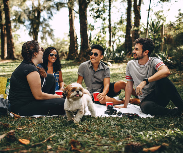 Group of cancer patients and survivors having a picnic in the park through the SPACE program and Places You'll Go