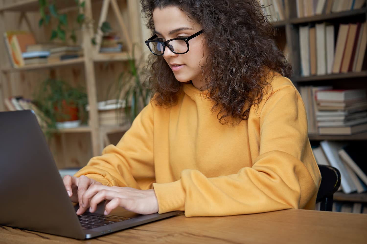 girl watching video on laptop