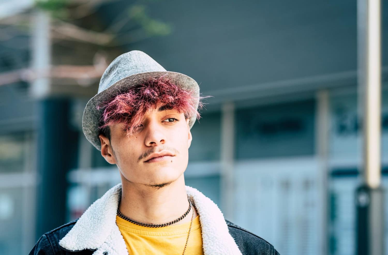 young person with pink dyed hair