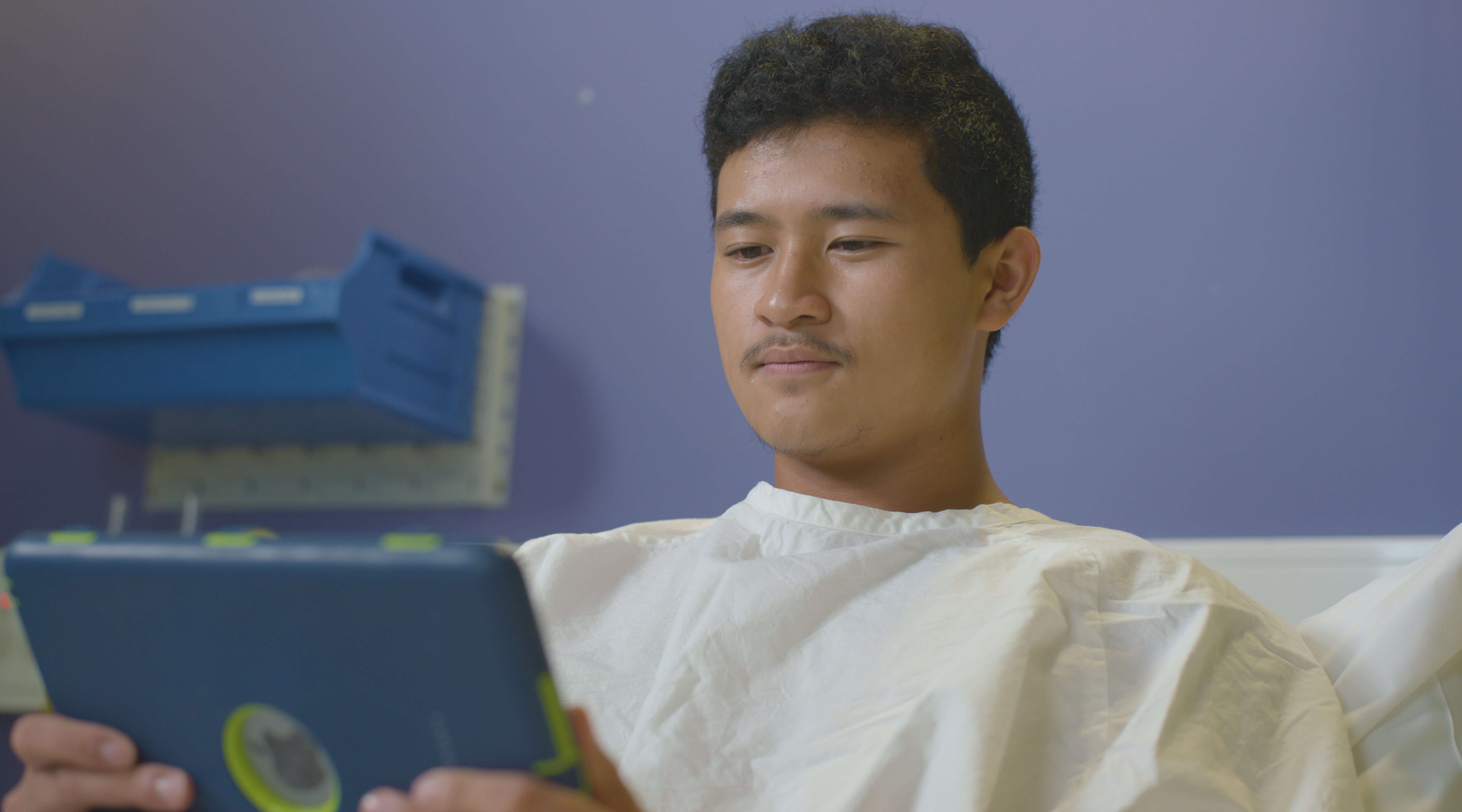 a young person in hospital using an ipad via Canteen's robots program