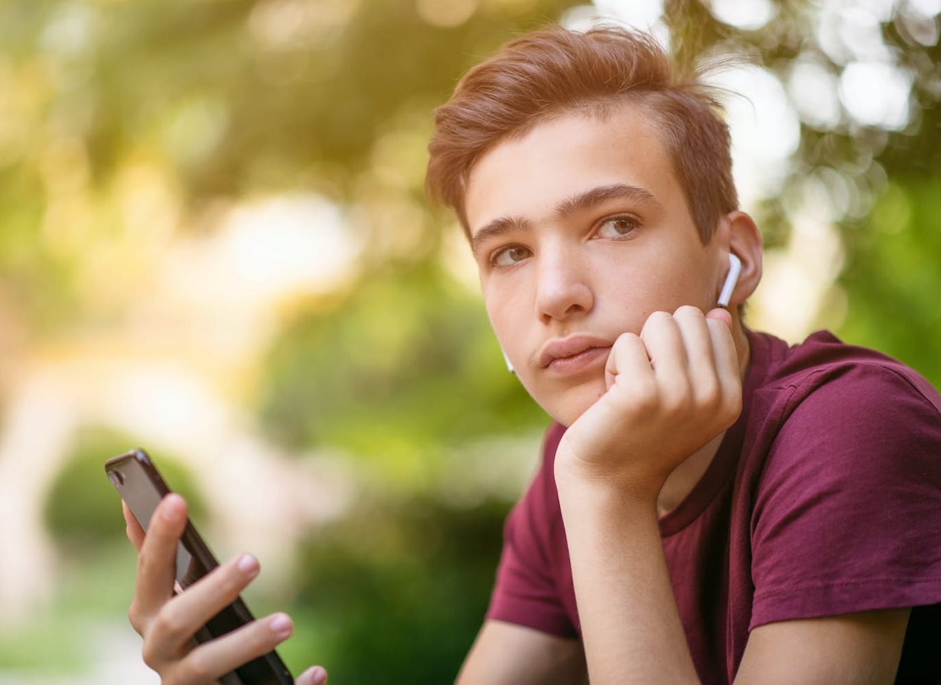 young person listening to canteen's cancer unscripted podcast