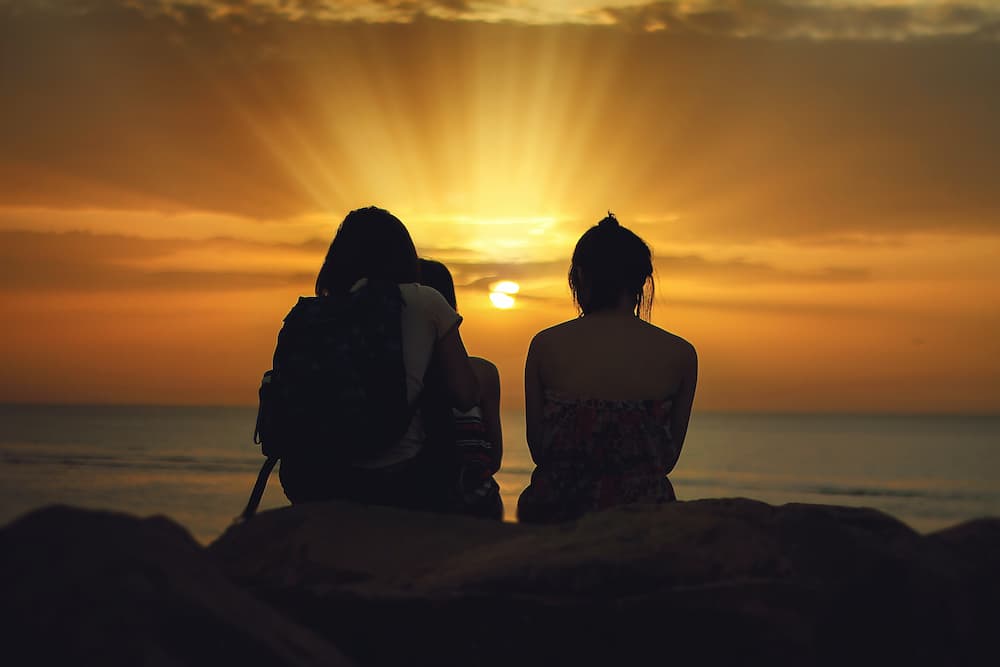 family watching sunset