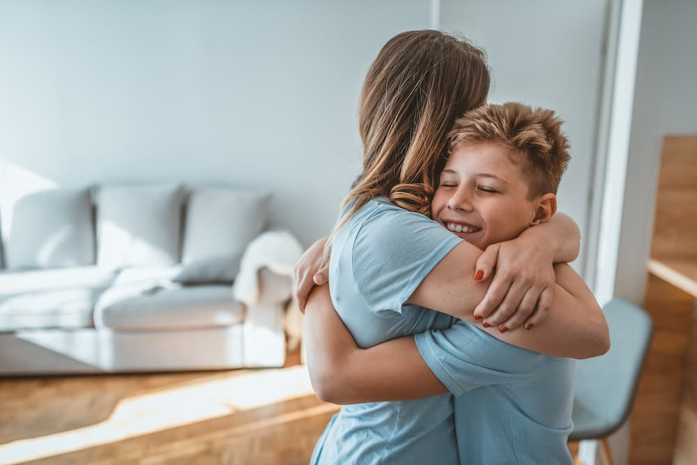 mother and son embracing