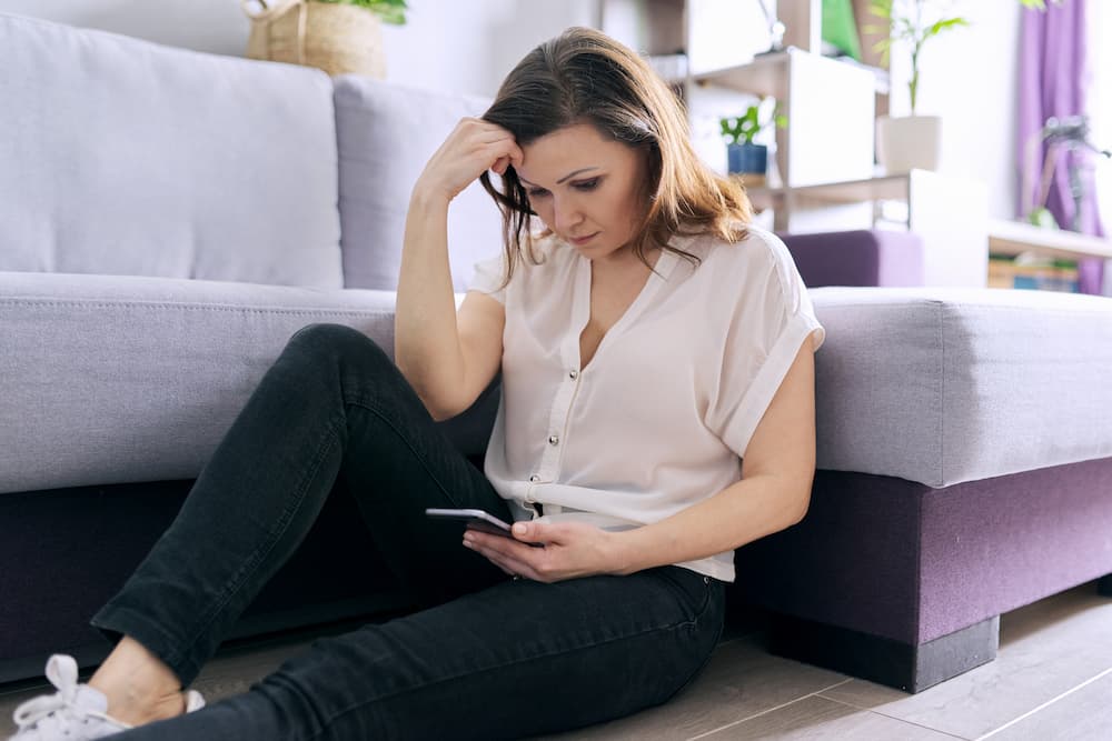 girl using phone to reflect