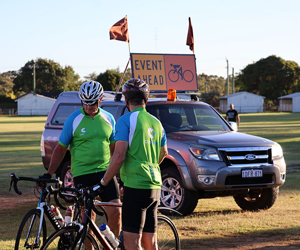 Two Canteen Life Cycle bike riders next to their bikes