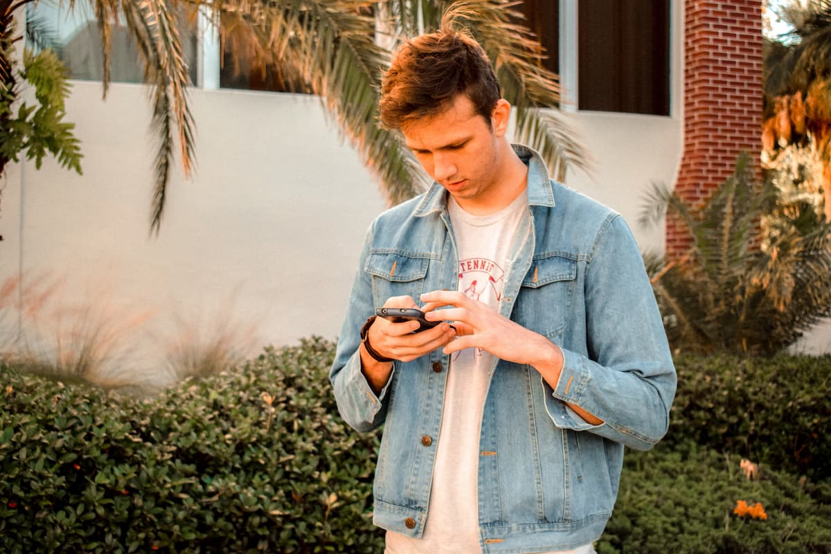 young man researching on phone