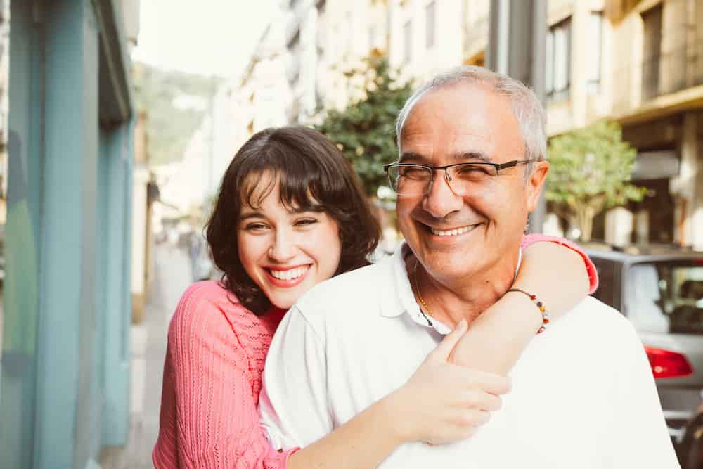 daughter and father hugging for free wills week