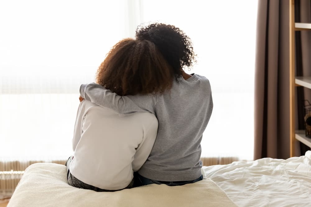 mother and daughter hugging