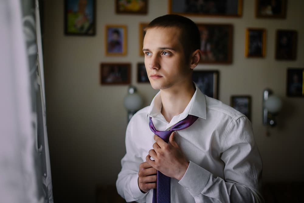 young man getting ready for funeral