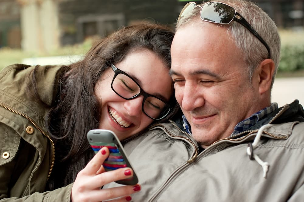 dad and daughter laughing