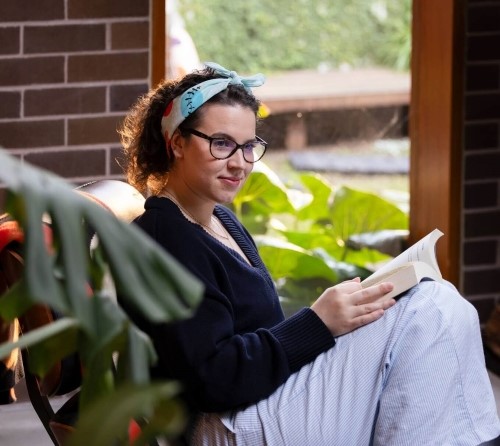 Saskia, who was helped by Canteens service, reading a book