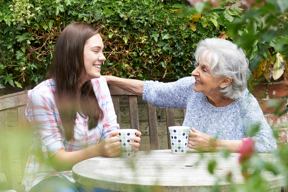 elderly woman discussing will with granddaughter elderly woman discussing will with granddaughter