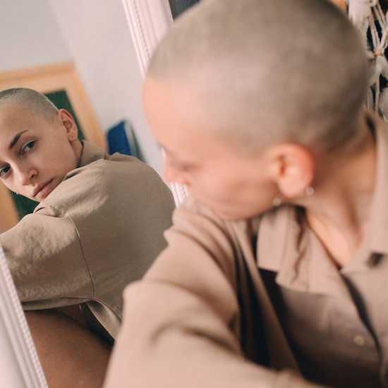 Girl looking at her reflection