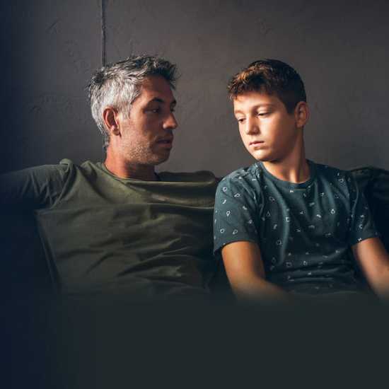 Father talking to son about cancer