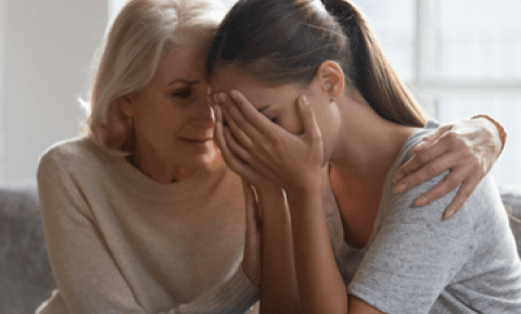 Mother comforting daughter