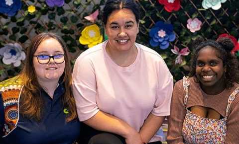 three young women smiling 