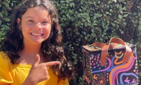 girl smiling with a canteen gift box