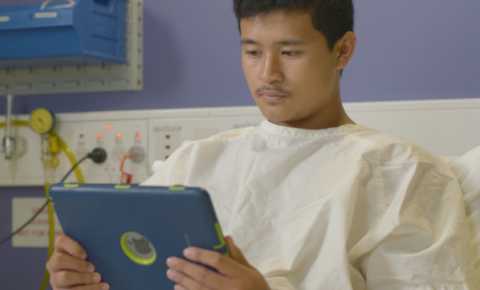 young person with cancer using canteen's robots service in hospital