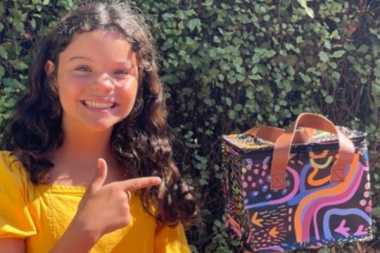 girl smiling with a canteen gift box