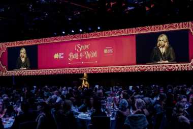 Sally speaking on stage at the Tour de Cure gala event