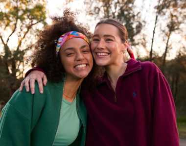 Two young women wearing Canteen bandannas smiling at the camera
