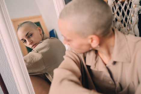 Girl looking at her reflection