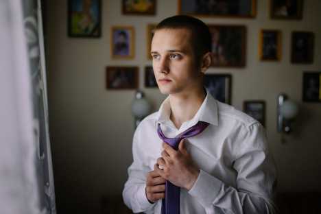 Young man getting ready for work