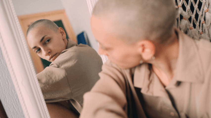Girl looking at her reflection