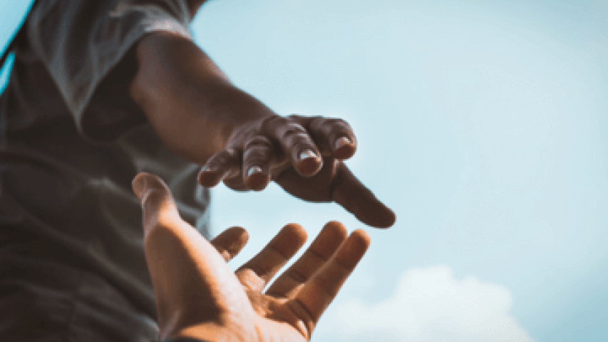 Two hands reaching out for support