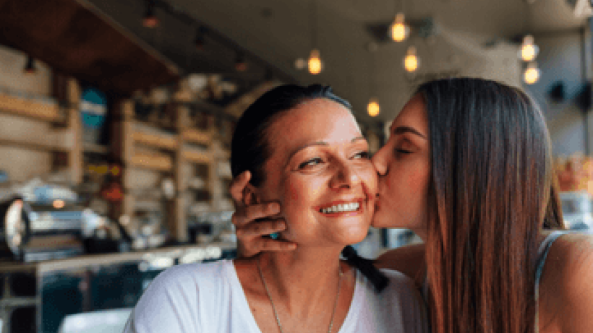Daughter kisses Mother