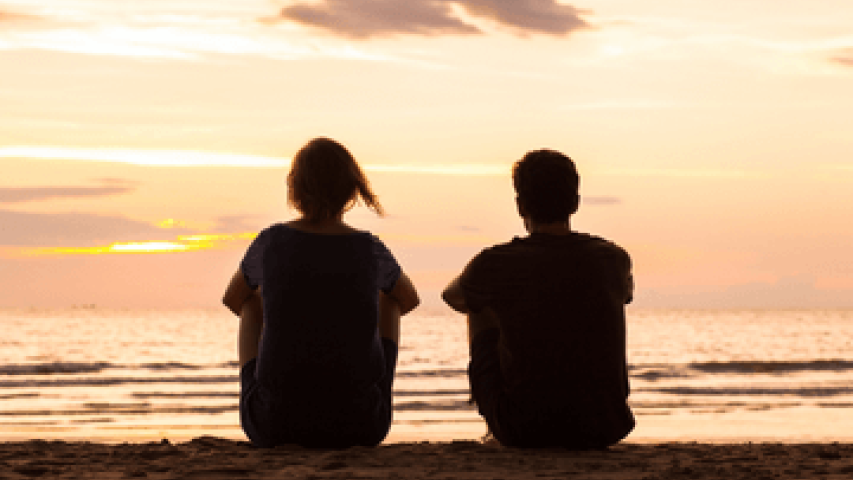 Siblings say goodbye on beach