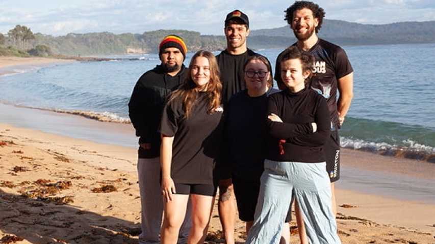 six young people standing on the beach at canteen's first nations cultural program