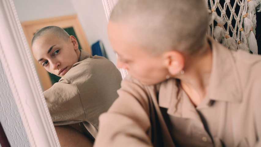 Girl looking at her reflection