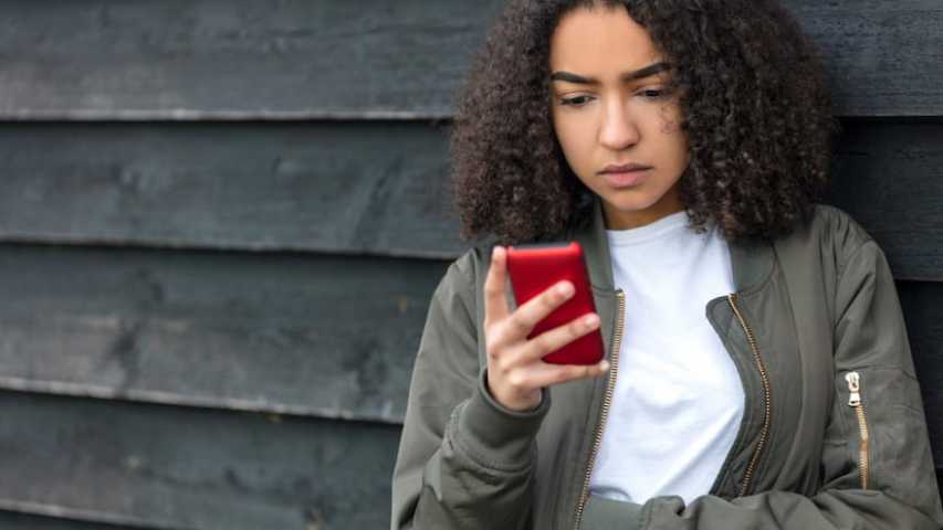 Girl seeking information about cancer on phone