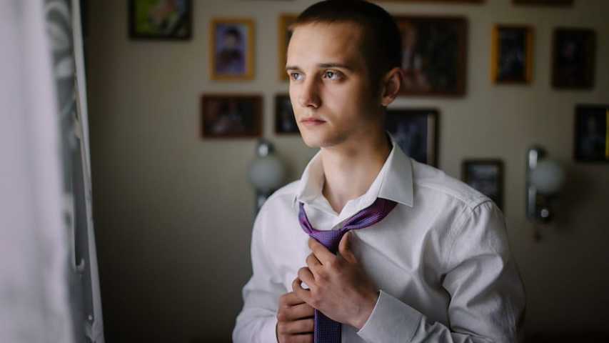 Young man getting ready for work