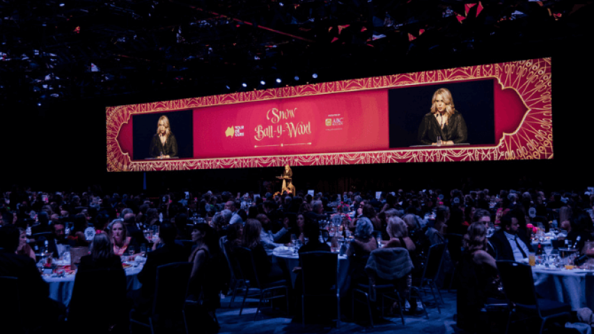 Sally speaking on stage at the event