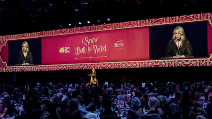Sally speaking on stage at the Tour de Cure gala event