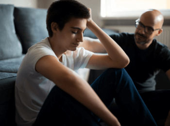 Son discussing cancer with his Father