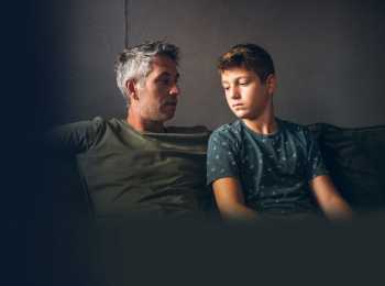 Father talking to son about cancer